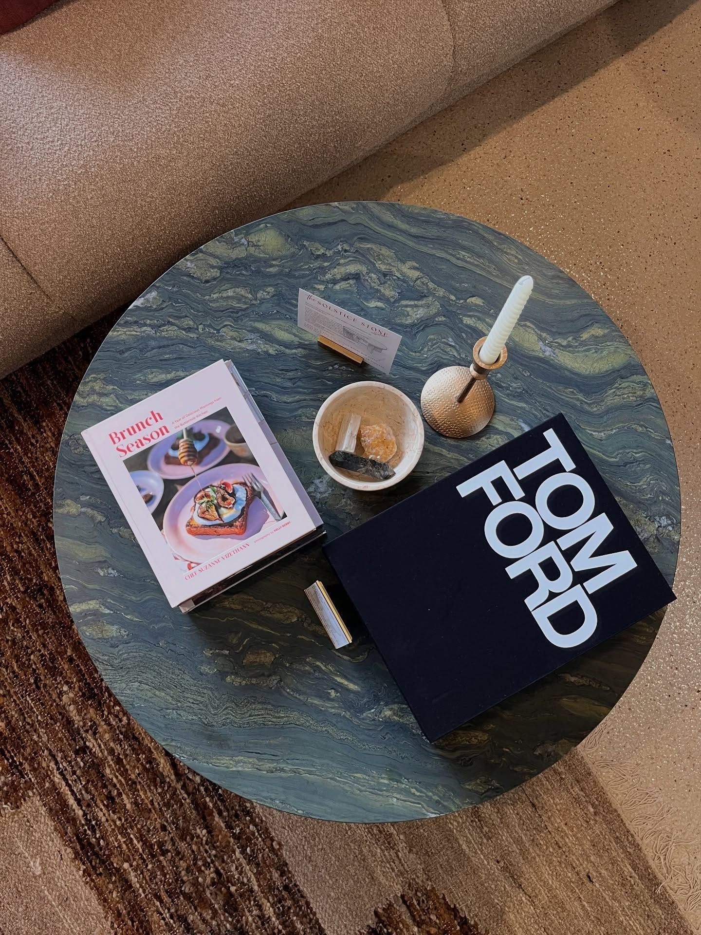 Round marble table with books, candle holder, and small dish  — Southeast Stone Pty Ltd In Caloundra West, QLD