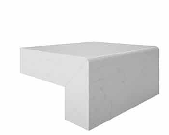 A white block is sitting on top of a white surface.