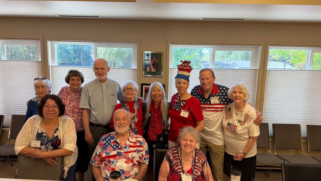 St. George's people get together for a festive photo wearing national colors, 