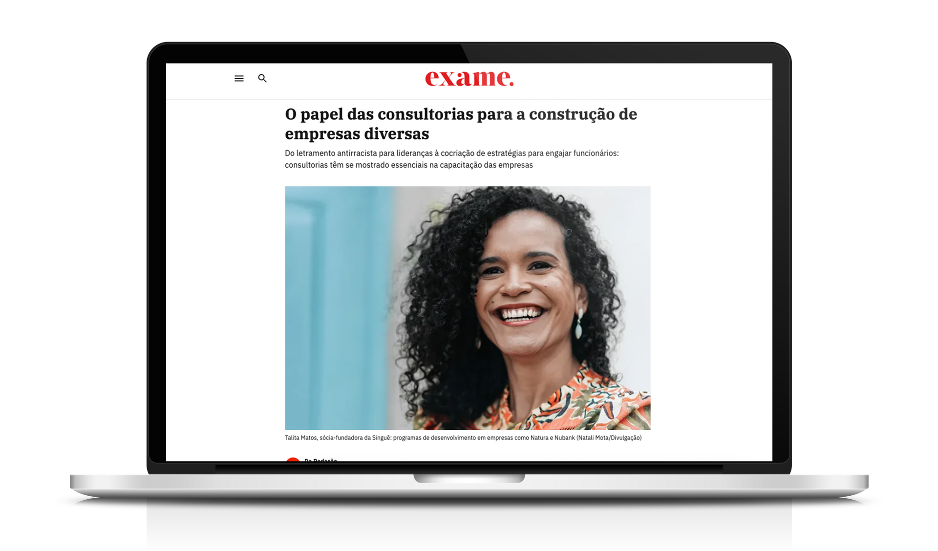 Laptop mostrando um artigo com uma mulher negra. Título do artigo: 