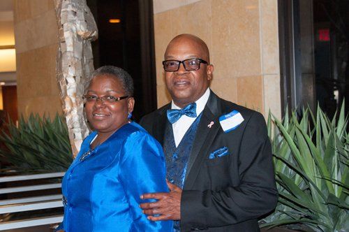 standing woman in blue dress