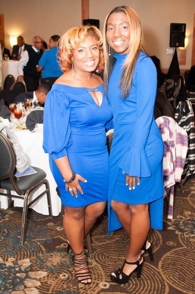 two woman in blue dress