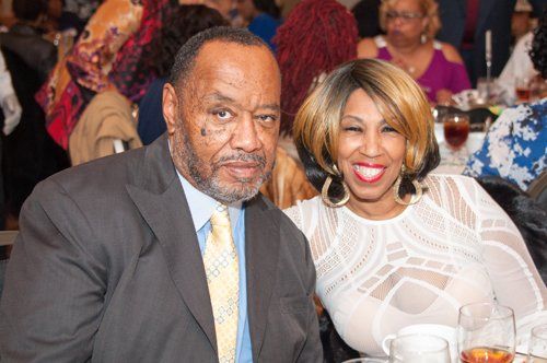 man and woman smiling