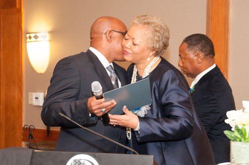 man and woman doing kiss on cheek