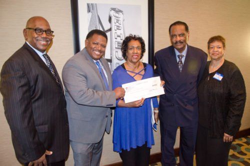 four people standing