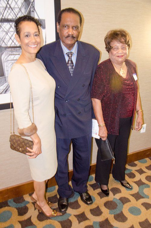 three people standing