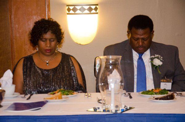 man and woman sitting next to each other