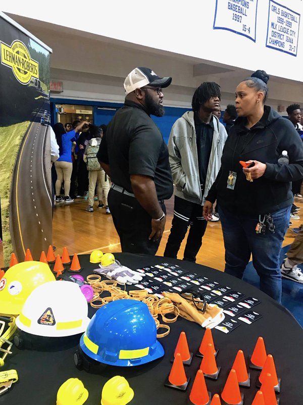 standing people and protective gears in table