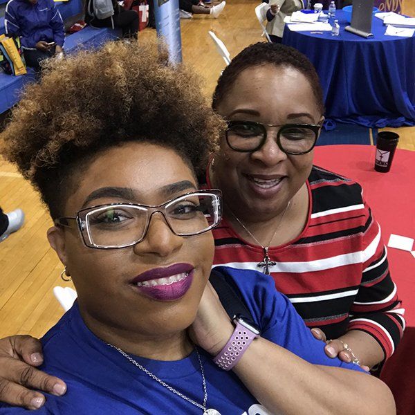 semi afro girl with another girl