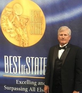 Woman tending to a vegetable garden, wearing gloves and crouching in front of raised beds, green plants. Woman tending to a vegetable garden, wearing gloves and crouching in front of raised beds, green plants.