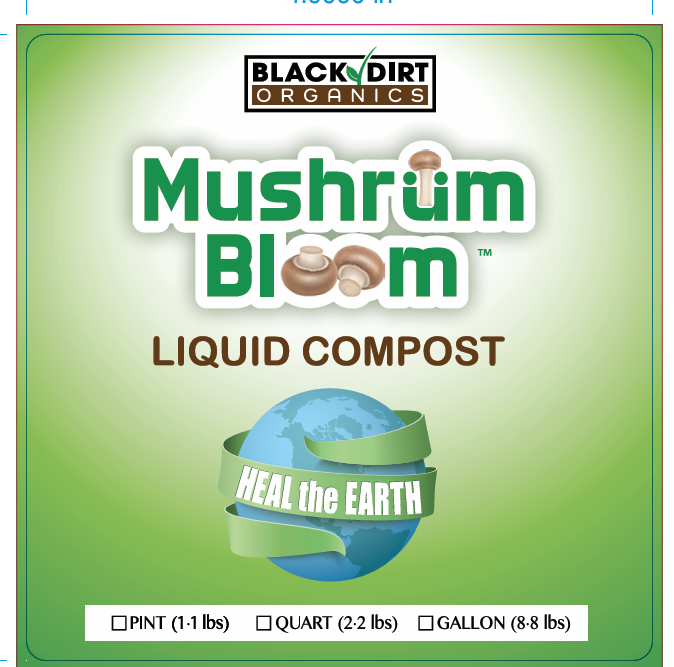 Person shoveling dirt into a wheelbarrow in a garden setting.