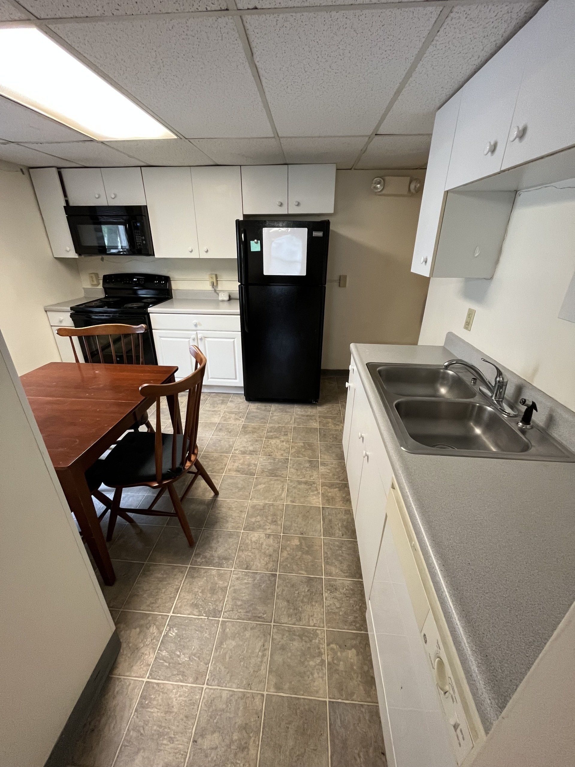 Kitchen with view of dining table and chairs