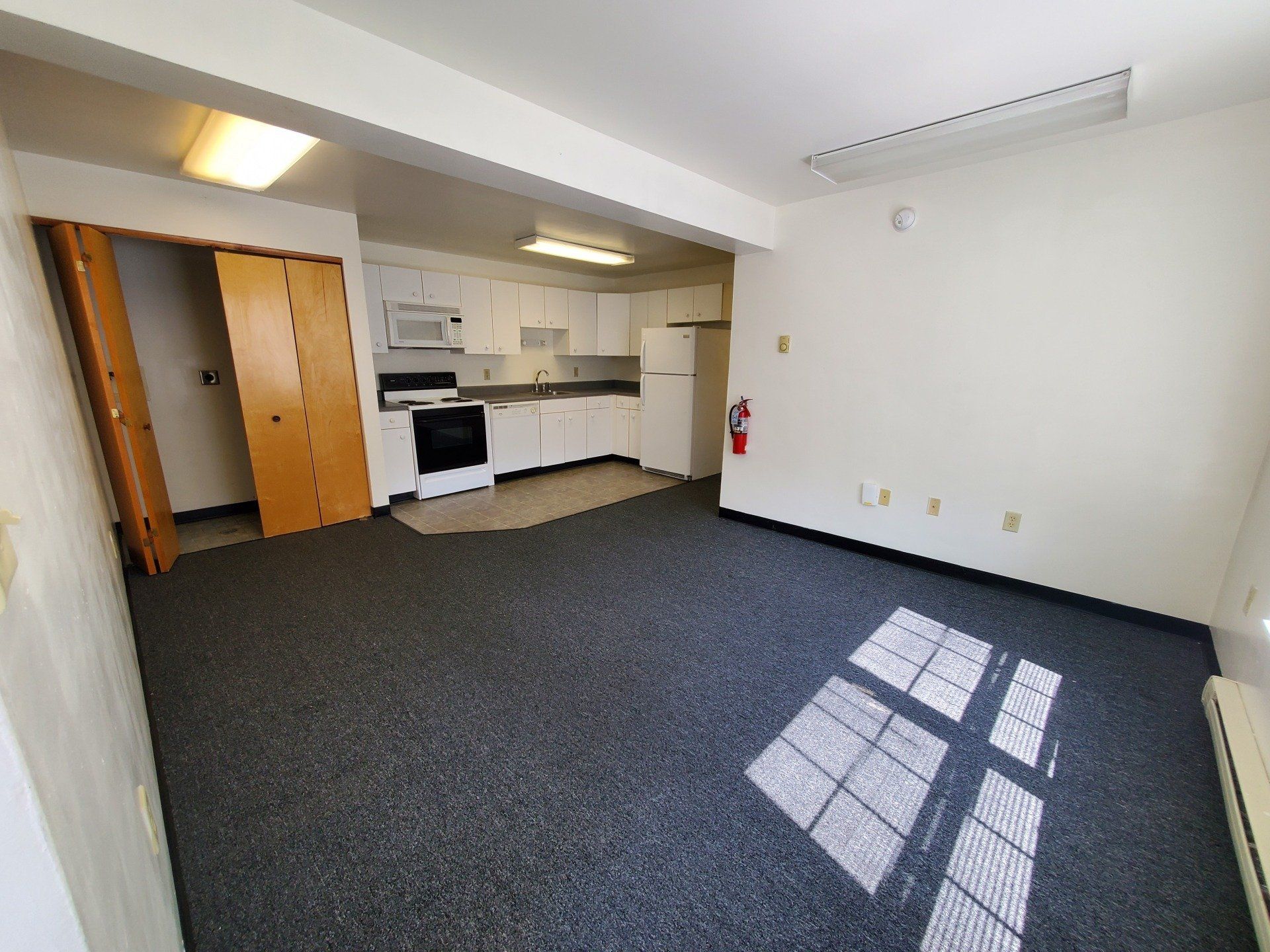 Living room view and kitchen
