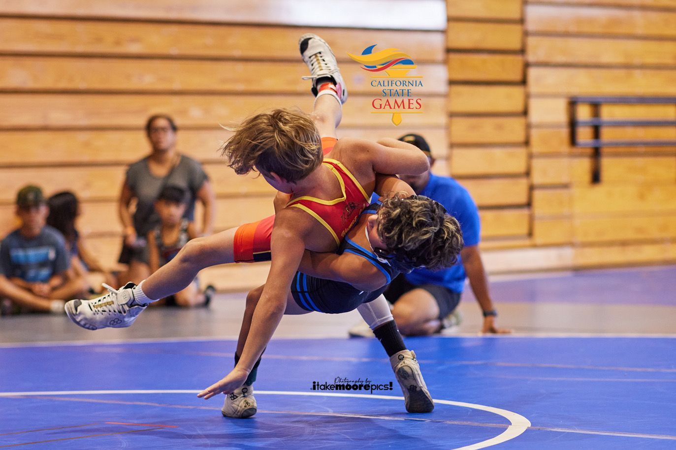 Two young men wrestling at california state games