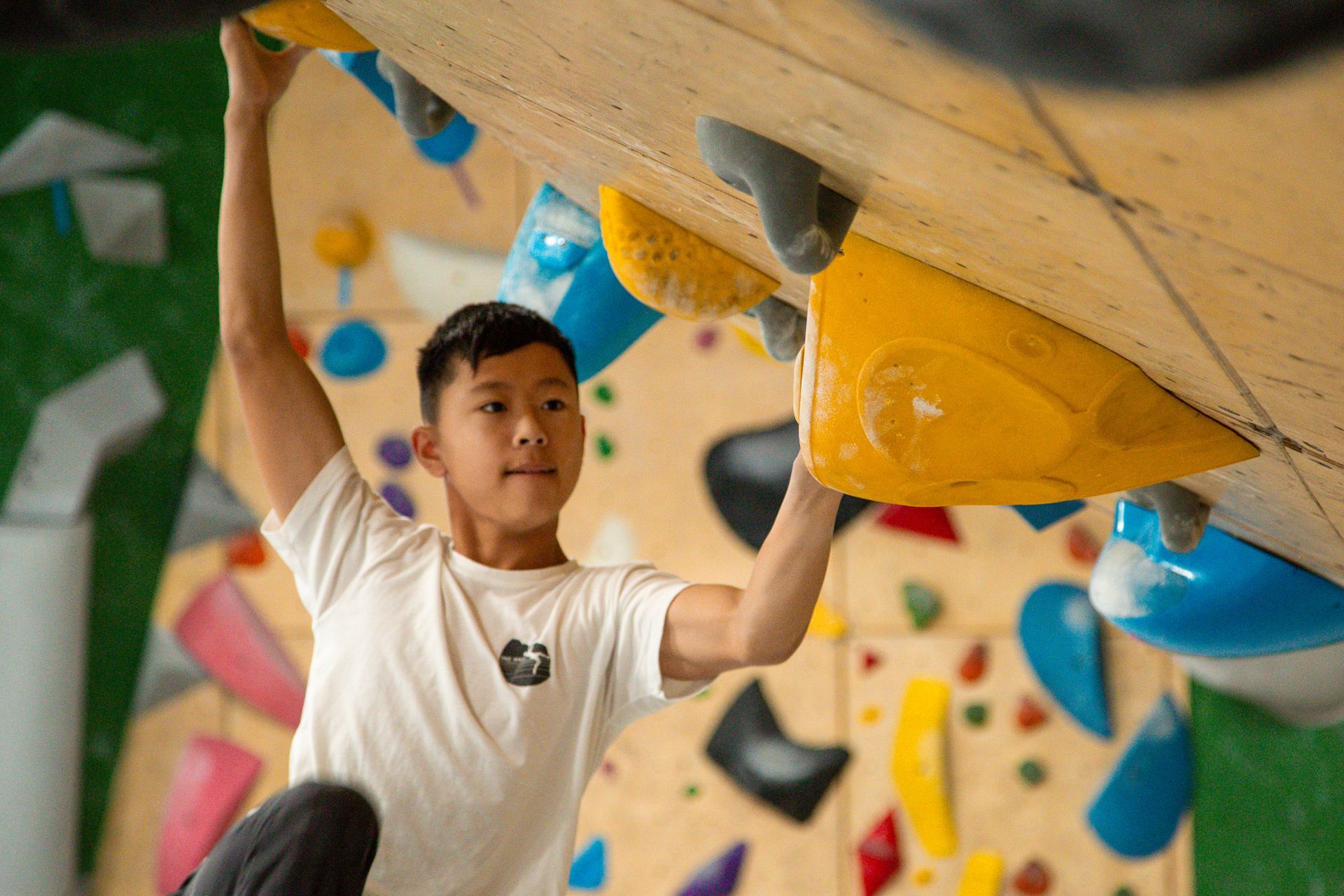 young boy wall climbing