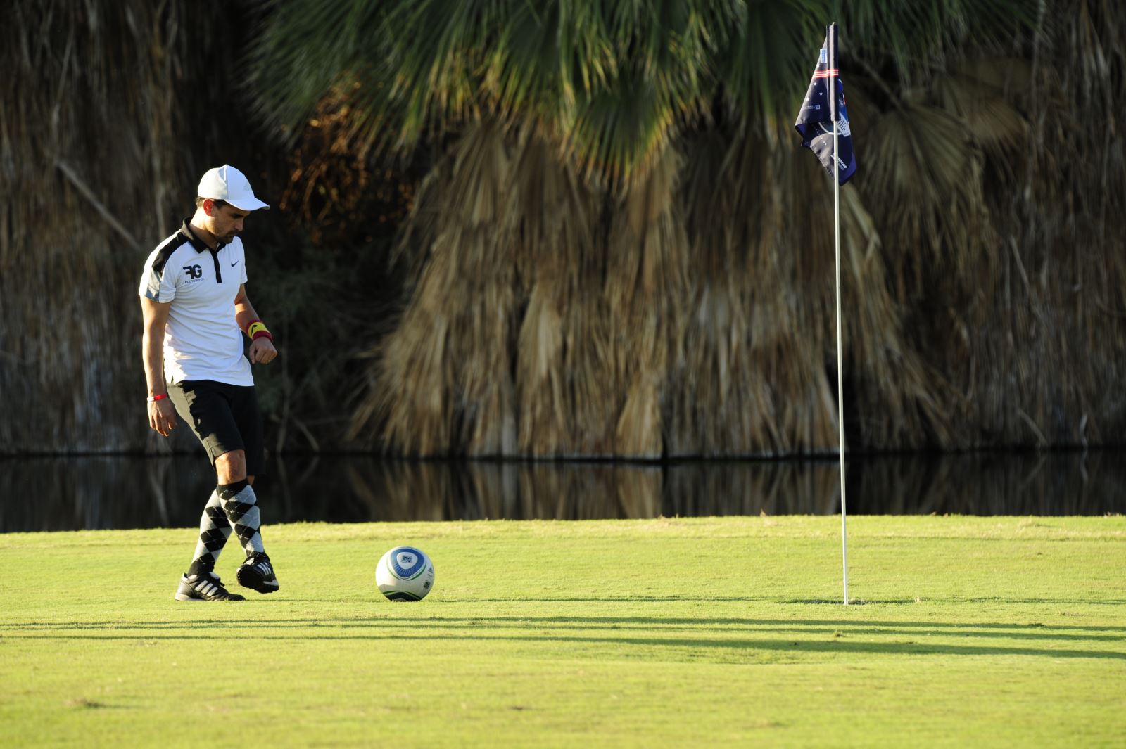 teenage boy playing footgolf