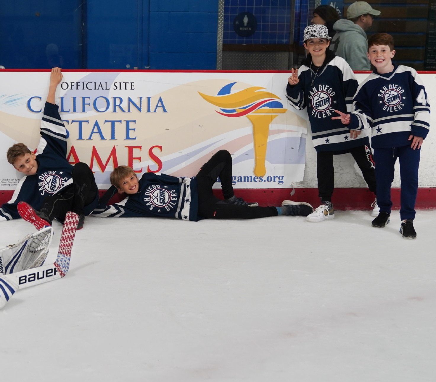 young men playing ice hockey