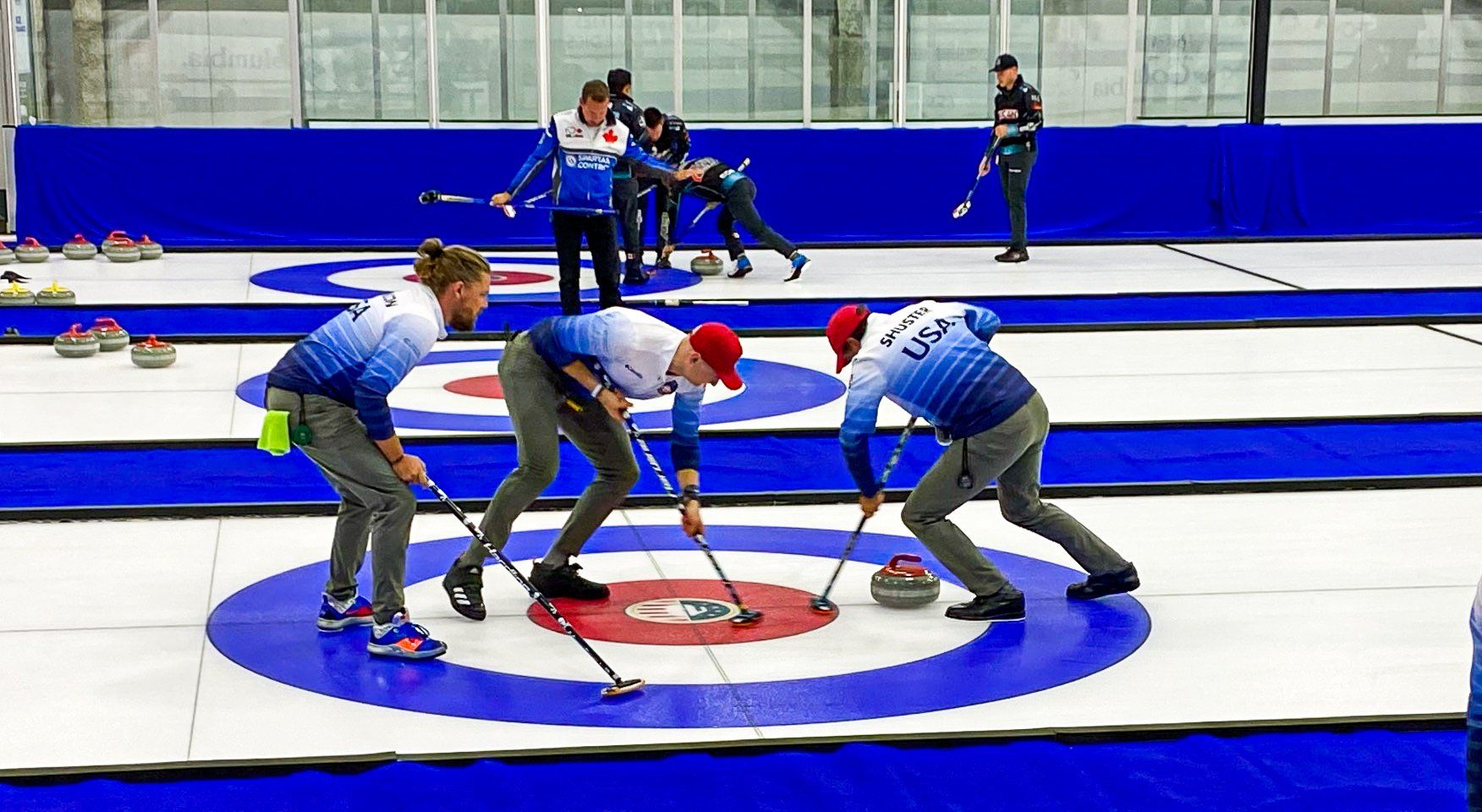 Curling team on ice.