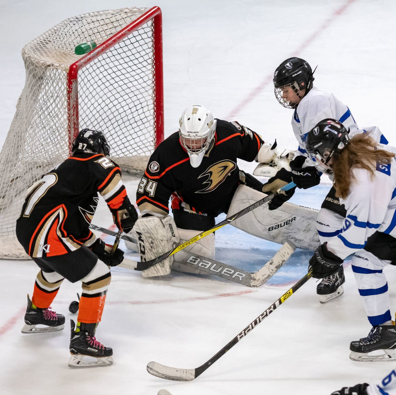 boys playing ice hockey