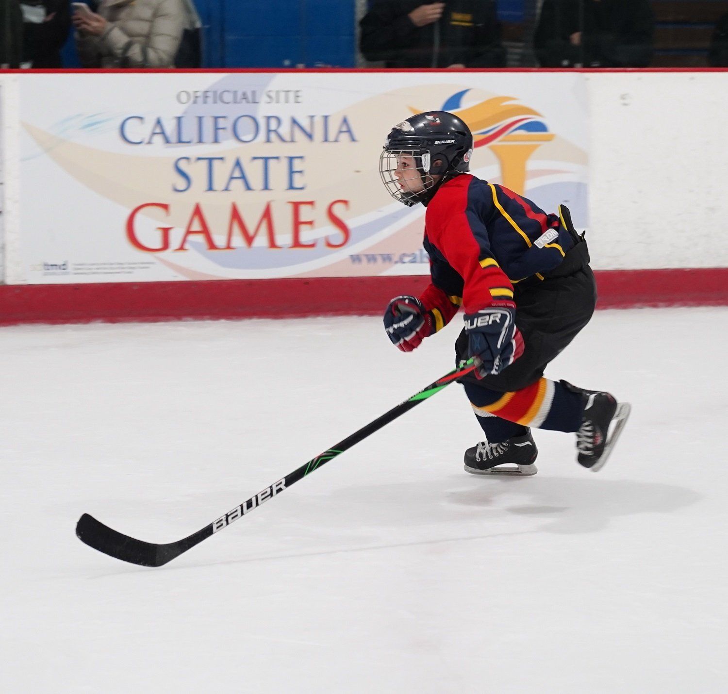 young boy participating in a hockey game
