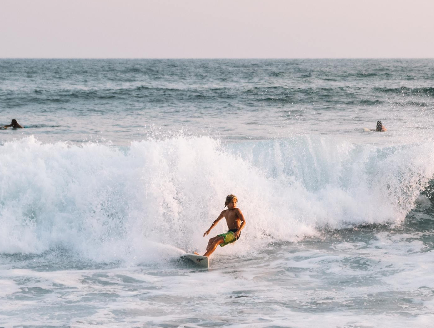 young boy surfing