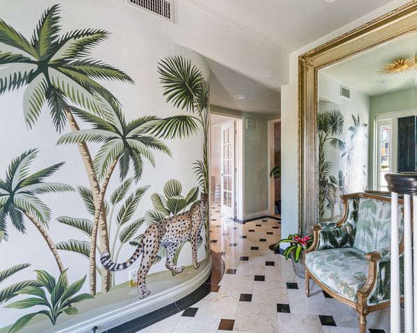 A living room with furniture and a ceiling fan