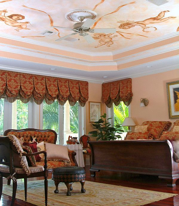 A living room with furniture and a ceiling fan