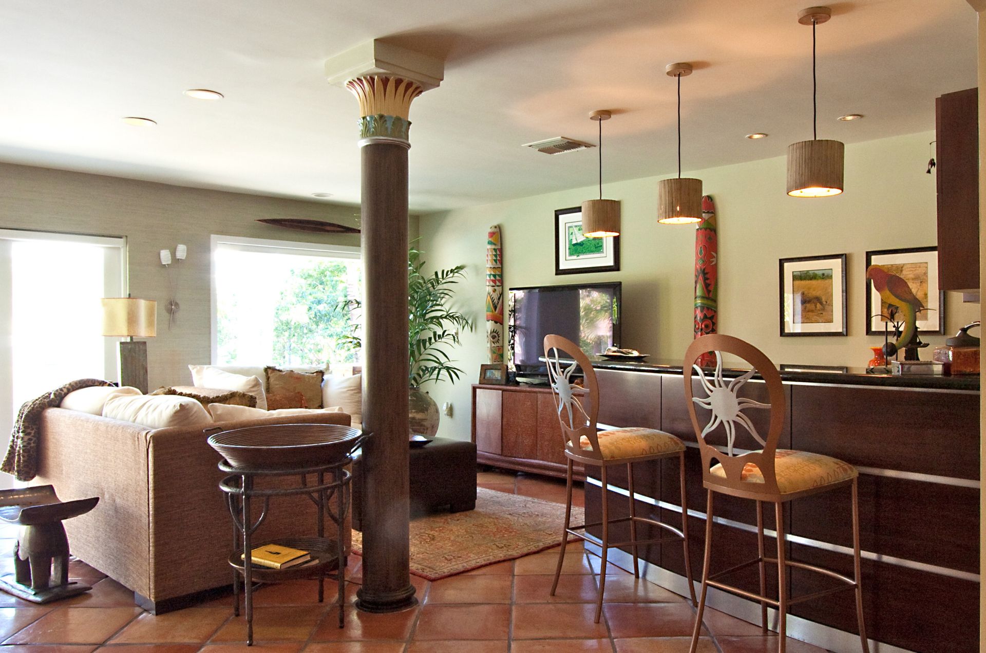 A living room with a couch and a bar