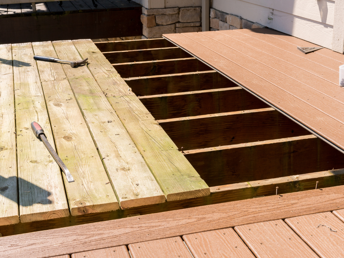 A wooden deck with a screwdriver on it