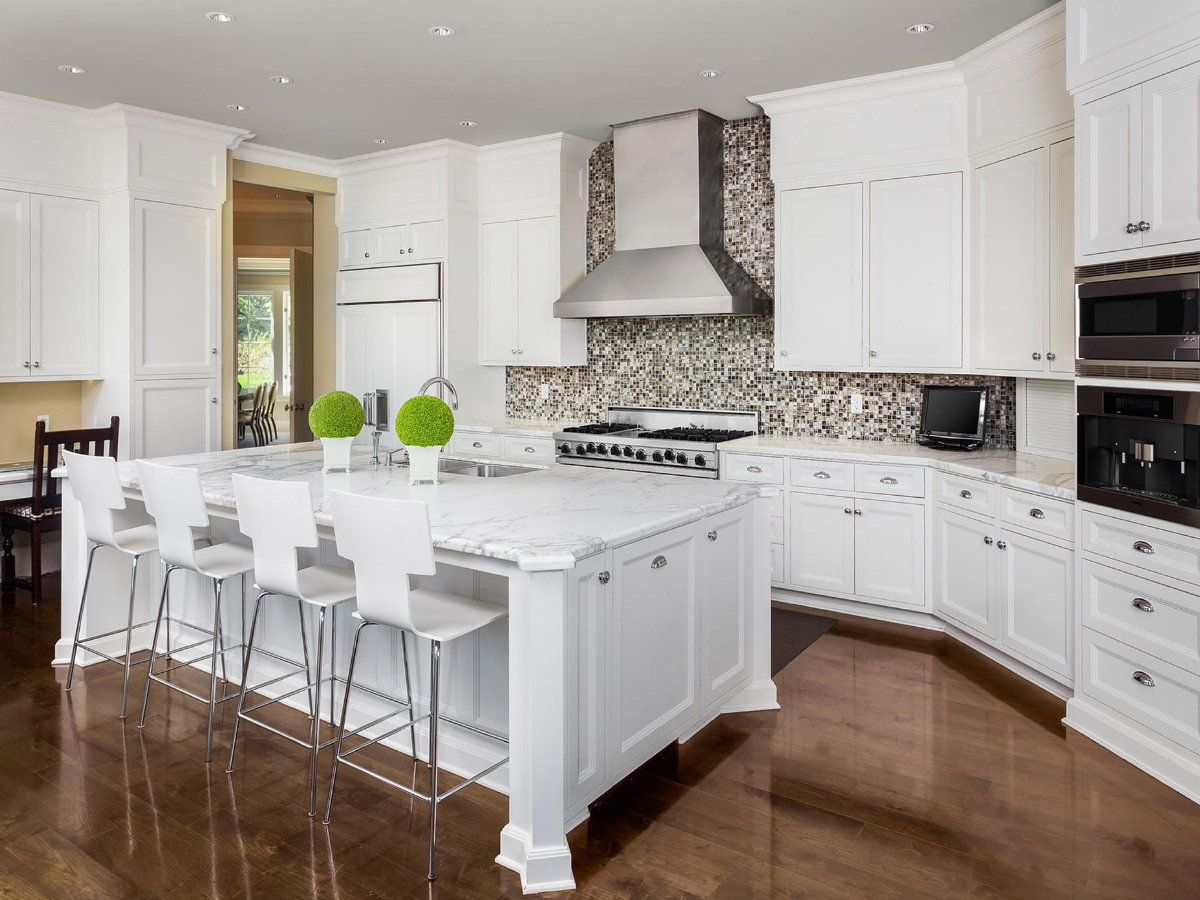There is a large island in the middle of the kitchen.