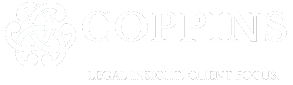 The logo for coppins law group , pllc is white.