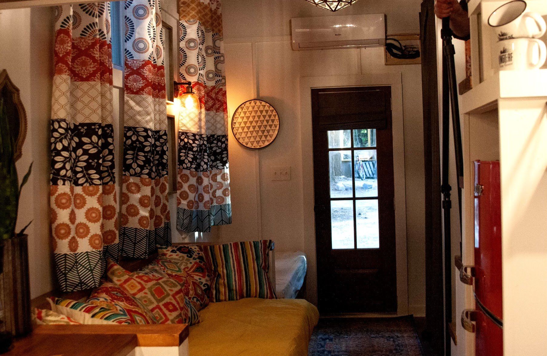 A living room with a couch and a door