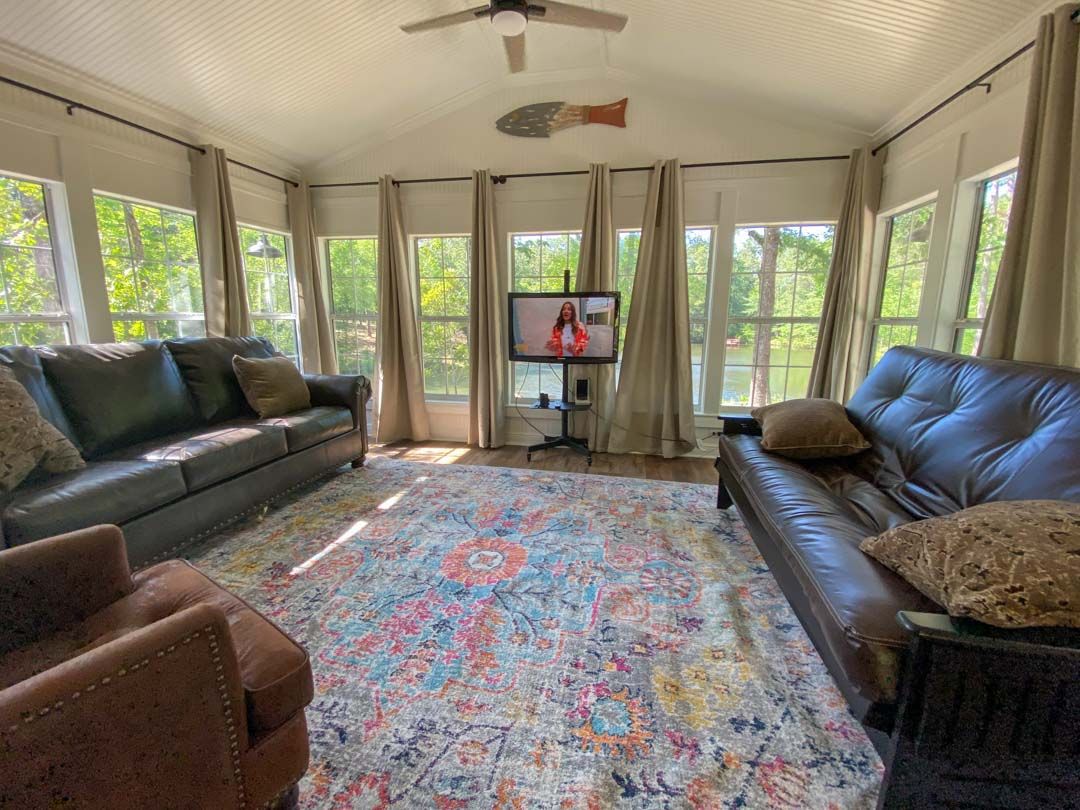 A living room filled with furniture and a television.