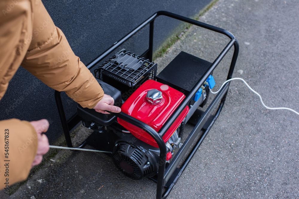 White house exterior with AC unit, white gutters, and small shrubbery.