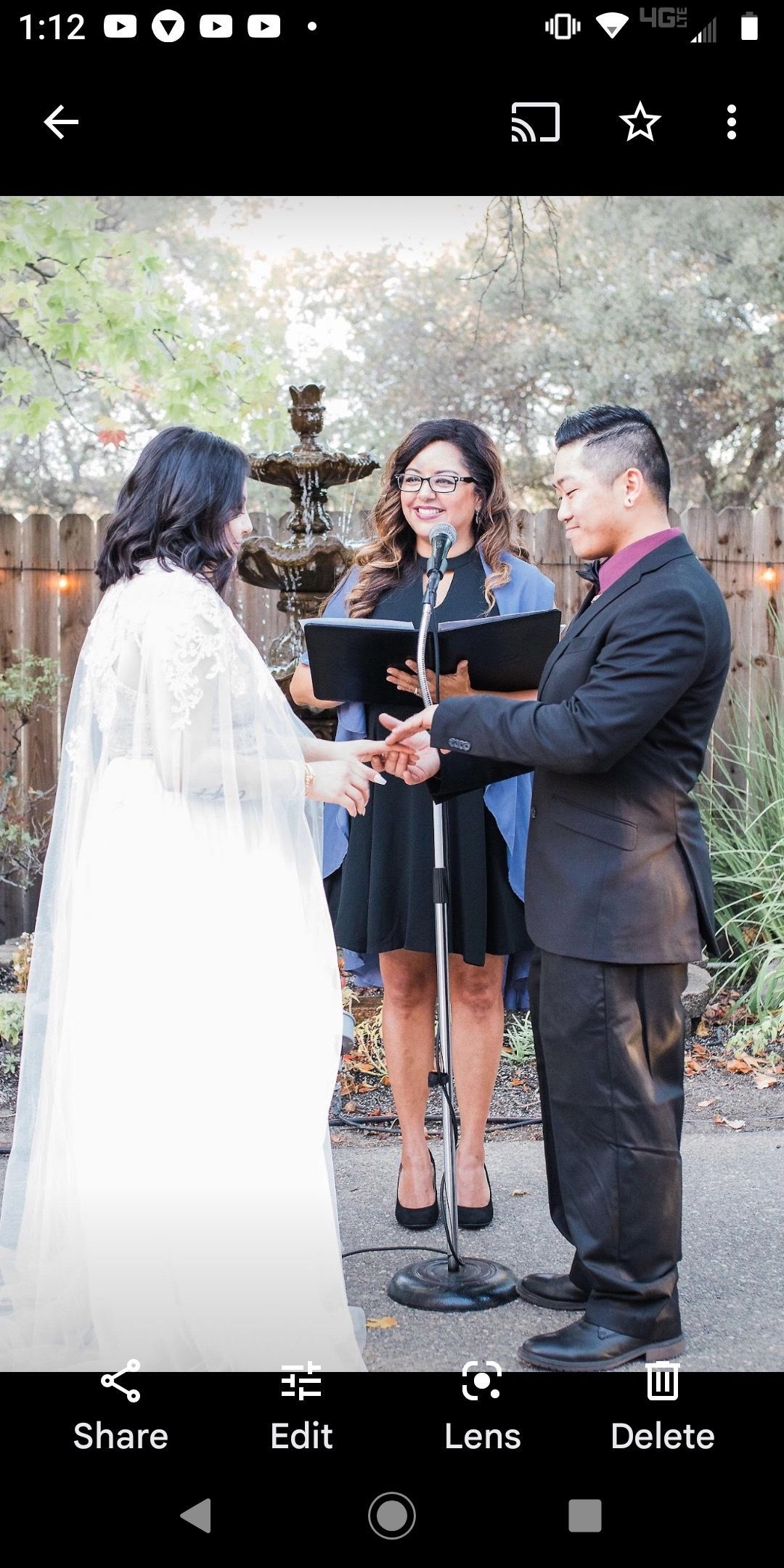 A bride and groom are getting married at a wedding ceremony.