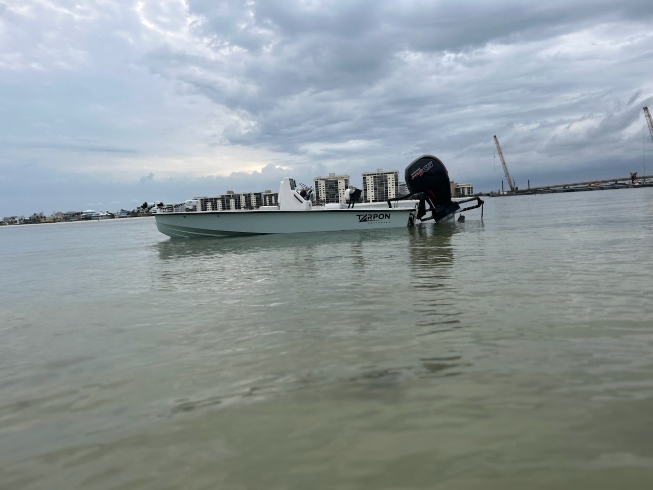 A boat is floating on top of a body of water.