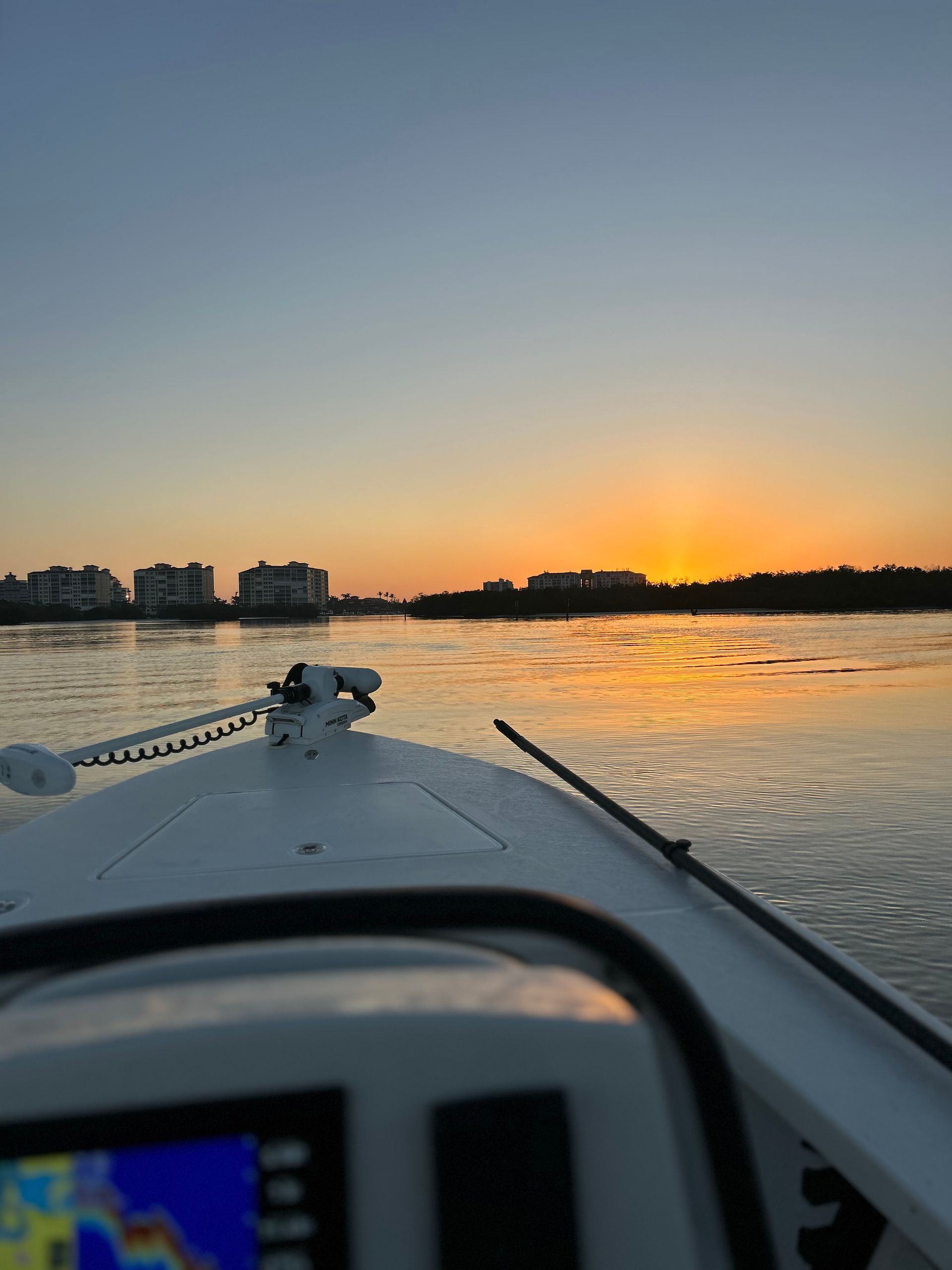 The sun is setting over a body of water