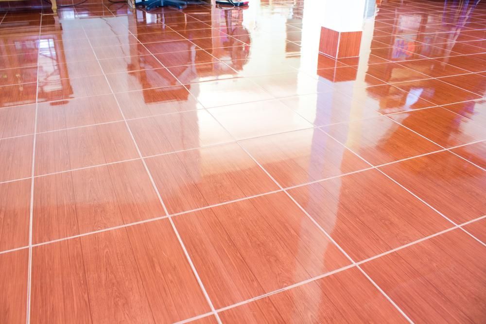 A Close up Of a Tiled Floor that Looks Like Wood — Slippery Solutions In Cranbrook, QLD