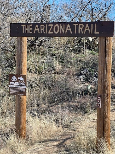 Wooden archway reads