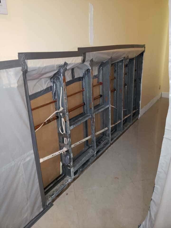 Kitchen area sealed off for mold remediation Fort Myers project to prevent contamination during restoration.