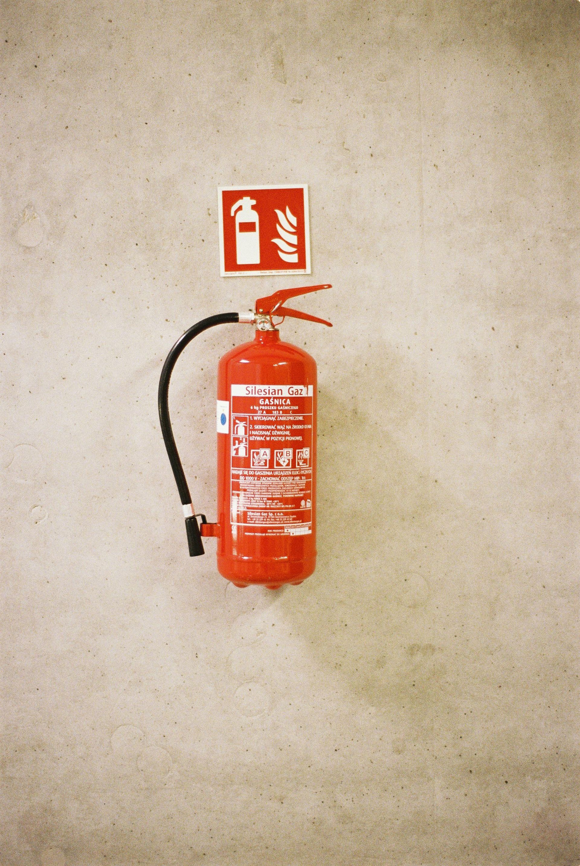Red fire extinguisher ready for use in a Fort Myers home