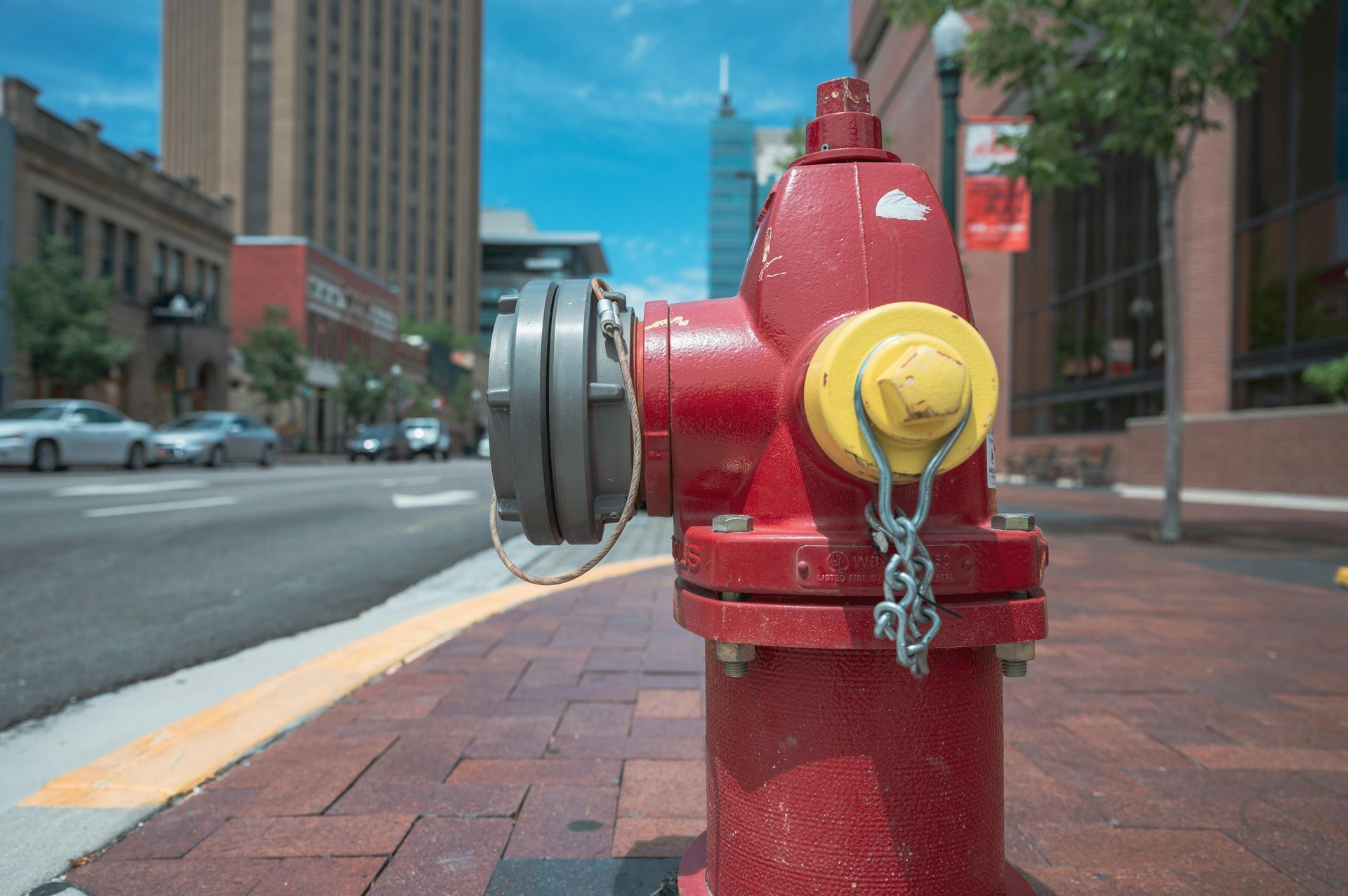 Fire hydrant outside a commercial building used during emergency fire response and damage cleanup
