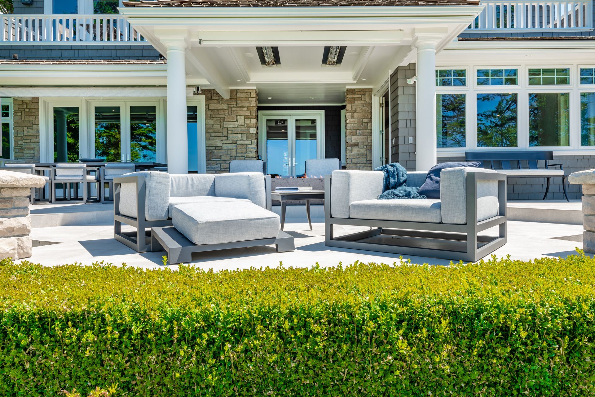 Luxury view home deck with ocean view fireplace hot tub and patio furniture