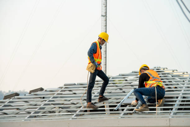 man and woman installing a metal roof in Allentown,PA 