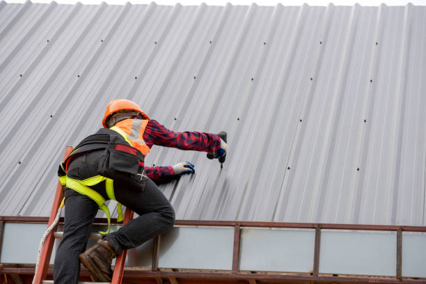 Man repairing and performing maintenance on a metal roof in Allentown, PA 