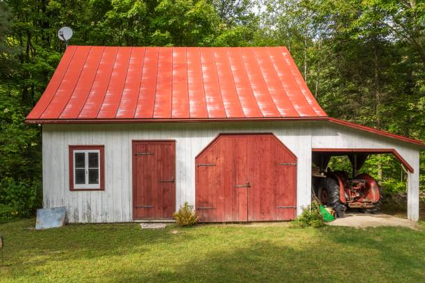 Red standing seam metal roofing on a barn house 