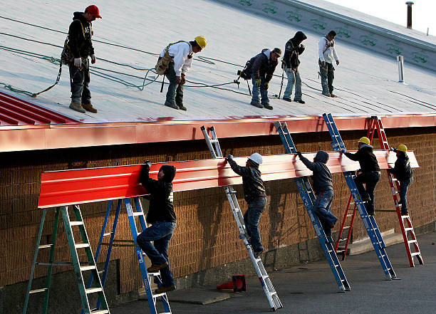 Roofers installing a standing seam metal roof in Allentown, PA 