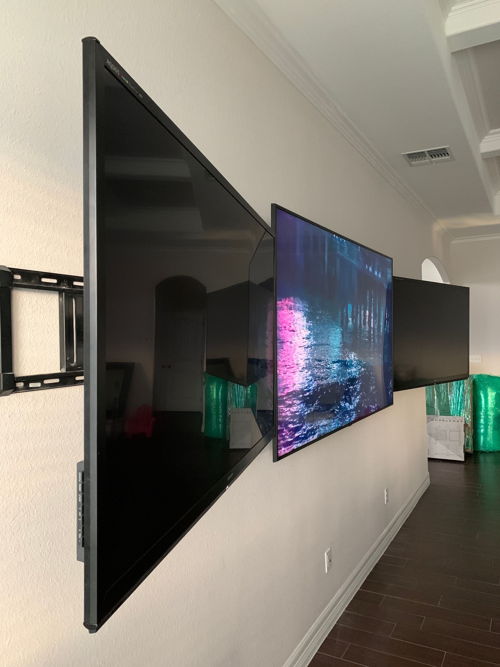 A large flat screen tv mounted on a wall