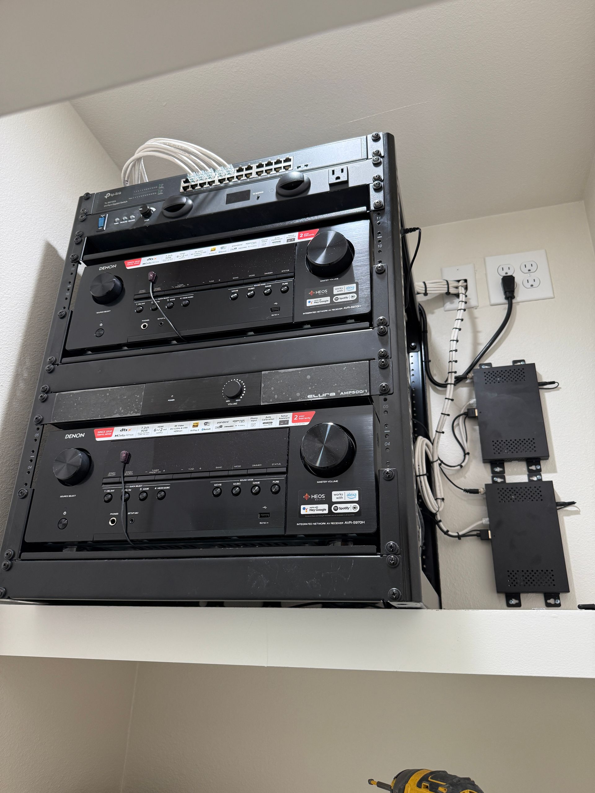 A shelf with a bunch of electronics on it