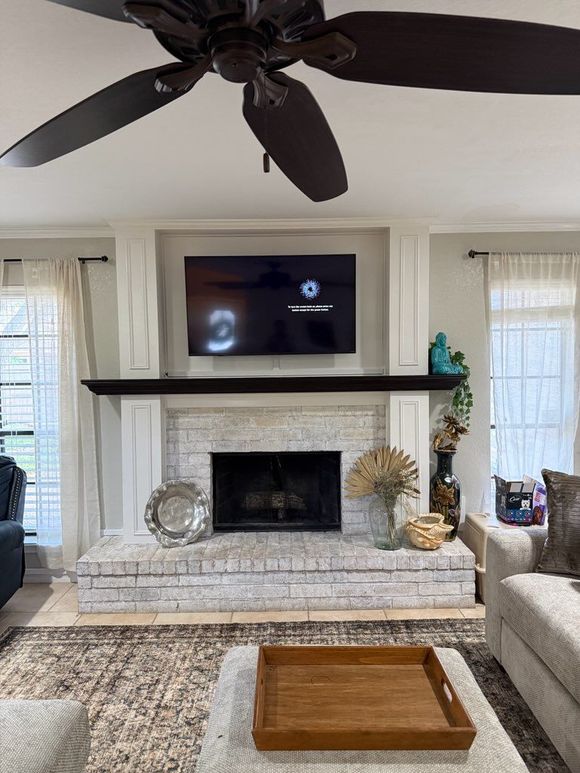 A living room with a large white screen on the wall.